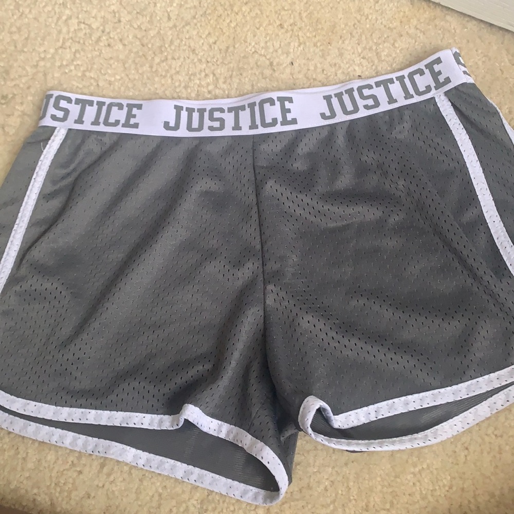 dark grey JUSTICE shorts.